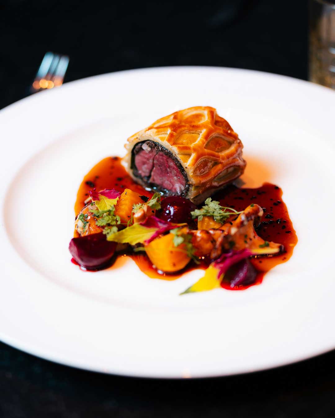 Individual beef Wellington with roasted beets, golden beetroot and red wine jus plated by a Cootoh private chef in Las Vegas