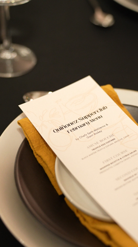 Printed supper club tasting menu card on a styled place setting at a Cootoh private chef dinner in Las Vegas